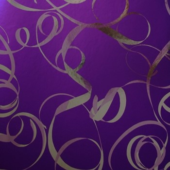 Gift wrapping paper purple with a silver ribbon on metallic paper.
 