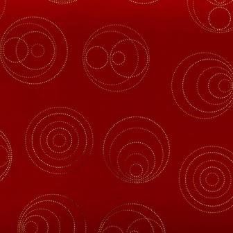 Gift wrapping paper gold and silver metallic shiny dots in a circle shape with a deep matte red background.
 